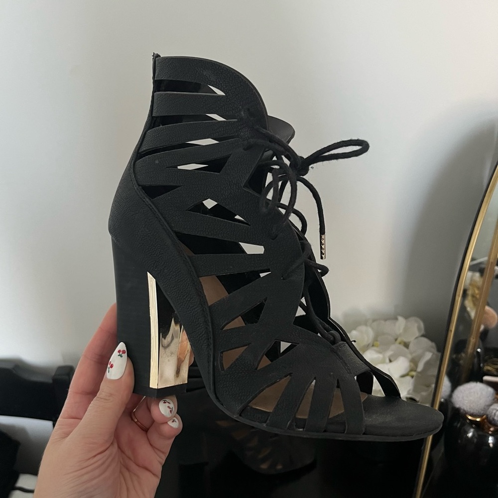 Black chunky lace up heels with gold detail